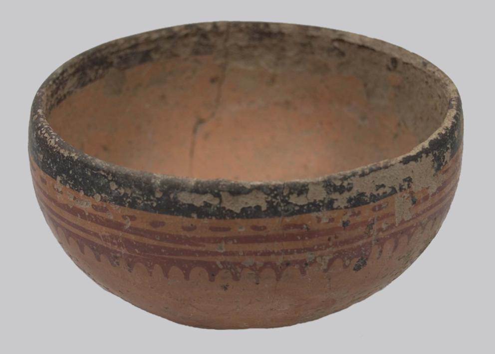 Bowl with black and red design around brim